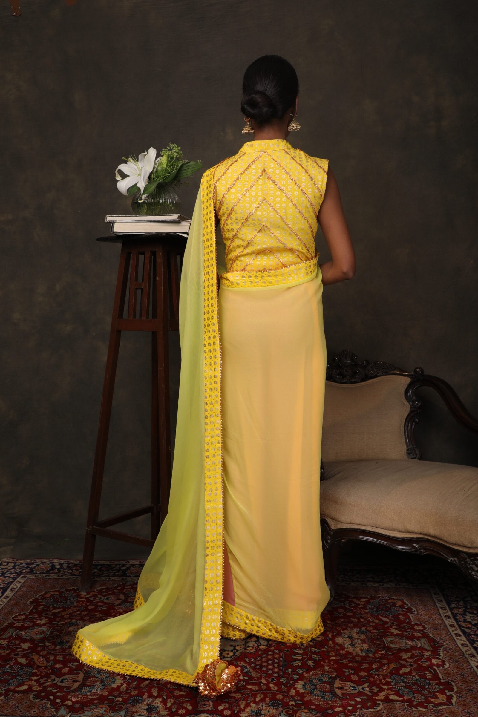 Lime green and lotus pink chiffon sari worn with lace detailed blouse