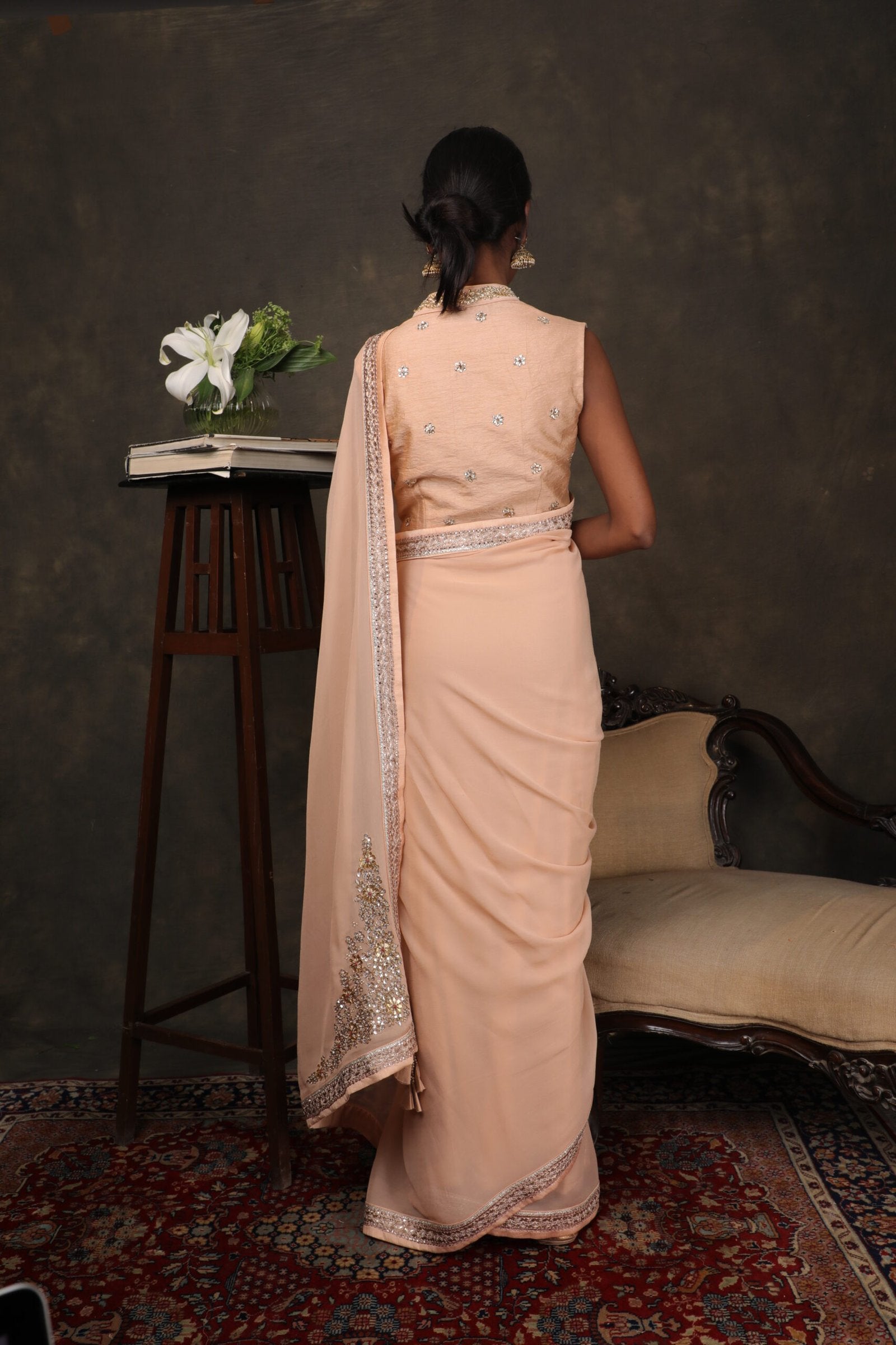 Caramel georgette saree with raw silk blouse.