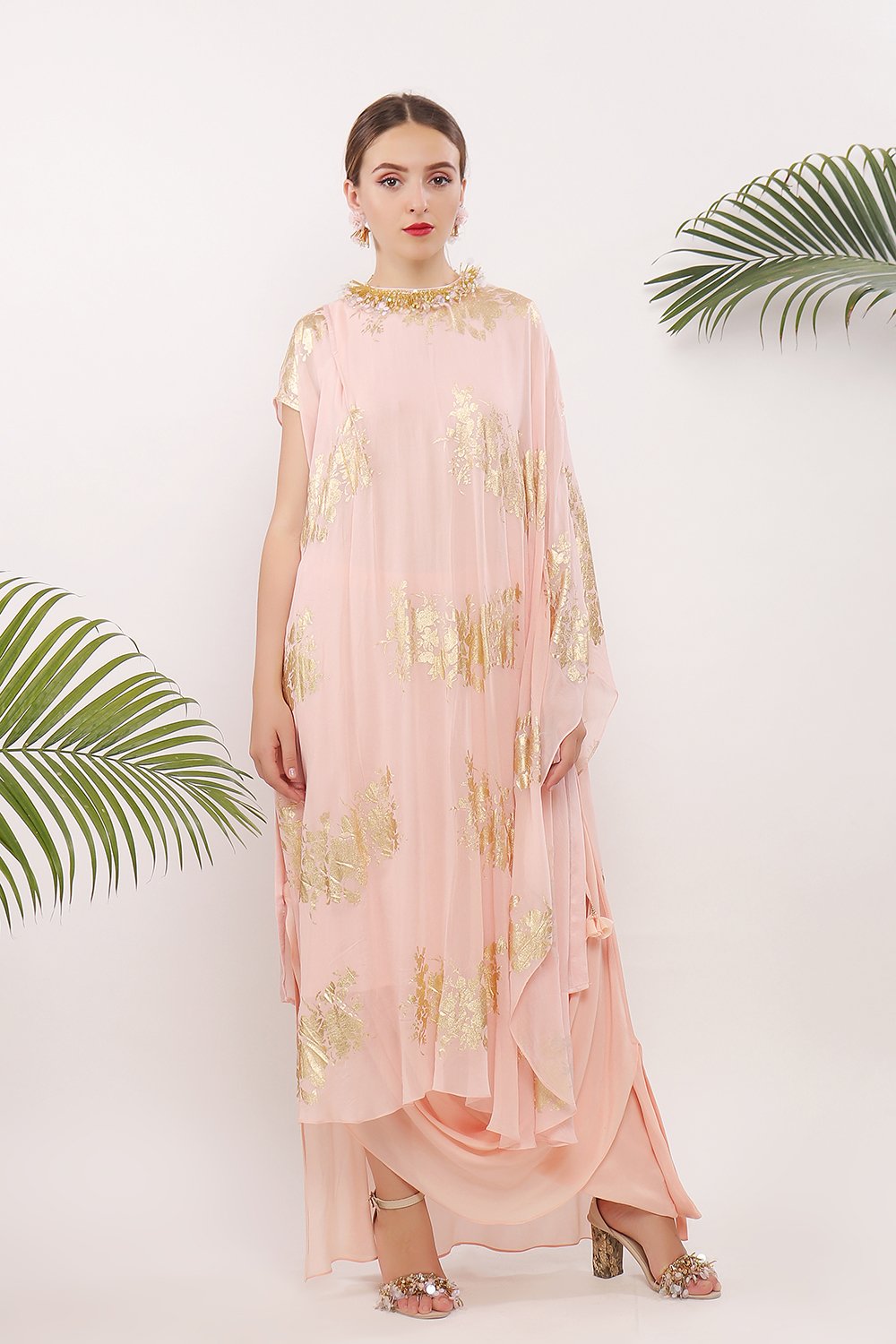 One pleat shoulder kaftan and embroidered neckline along with cowl skirt
