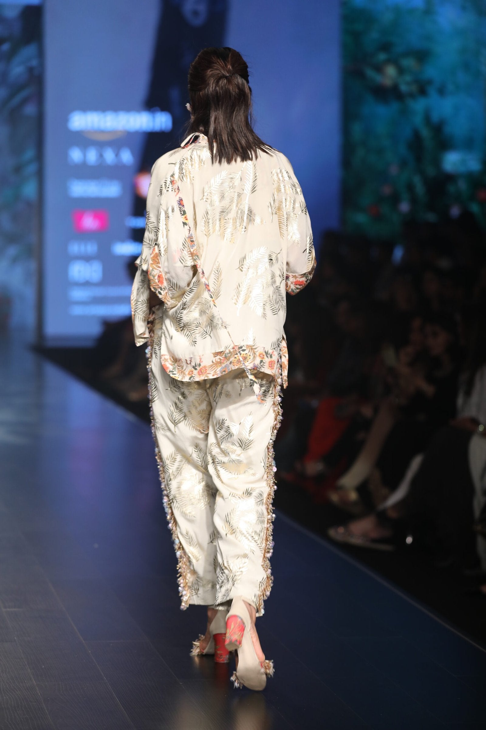 gold printed jacket with scalp pleated flared top and high waisted pants