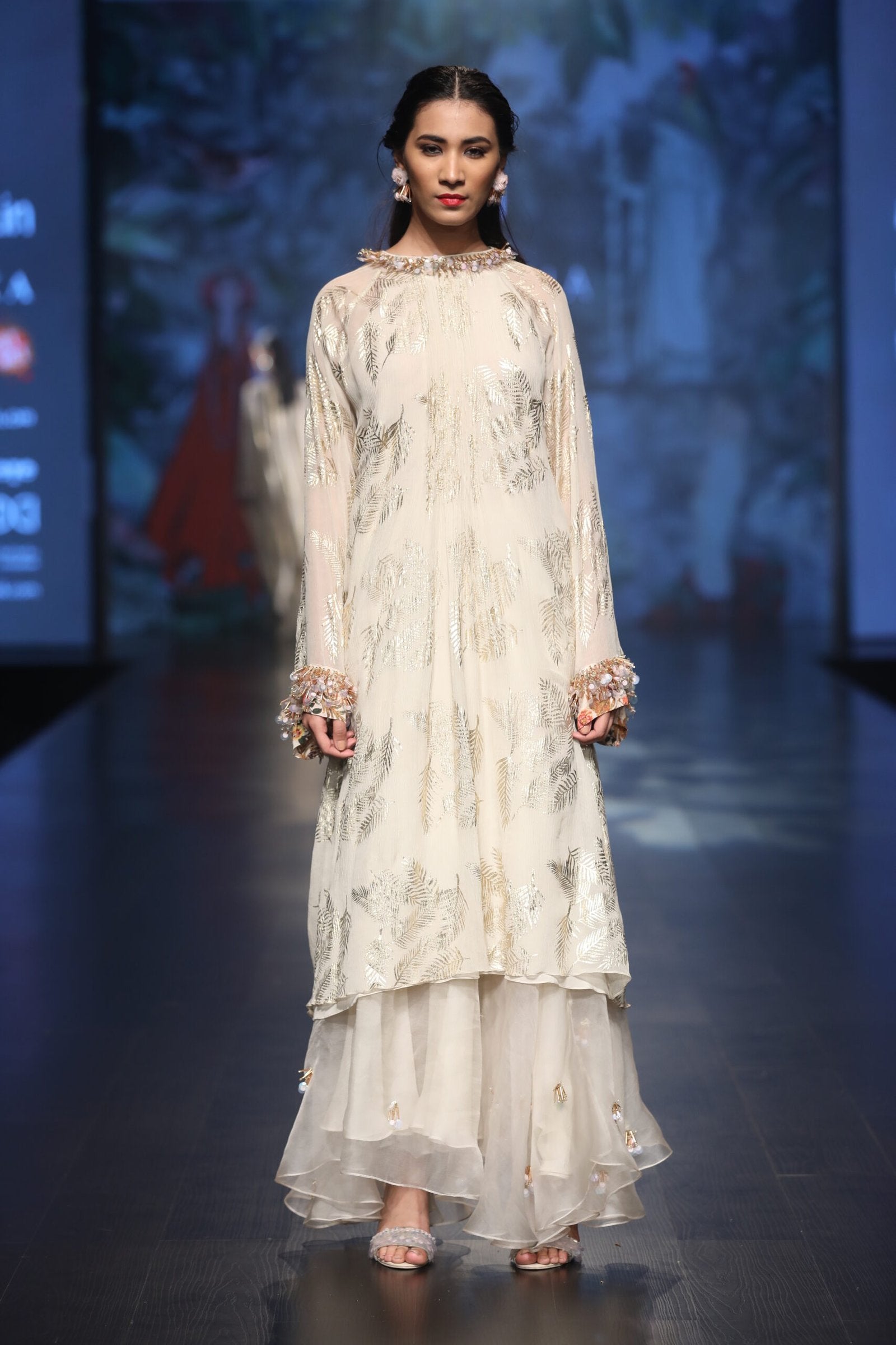 gold printed asymetical tunic with pleated asymetical skirt