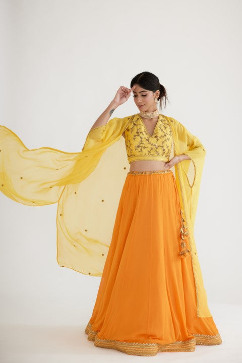 Ochre Yellow Lehenga paired with Yellow Blouse and Cape