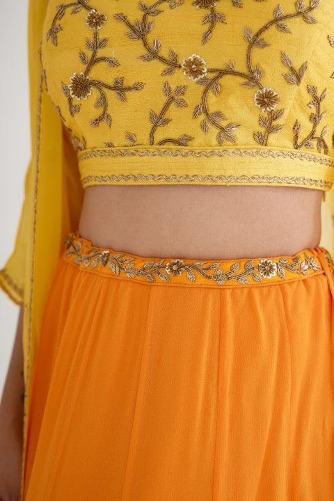 Ochre Yellow Lehenga paired with Yellow Blouse and Cape