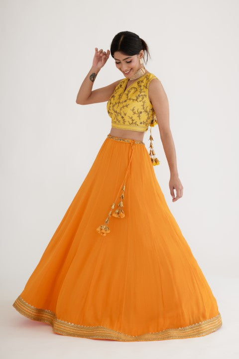 Ochre Yellow Lehenga paired with Yellow Blouse and Cape