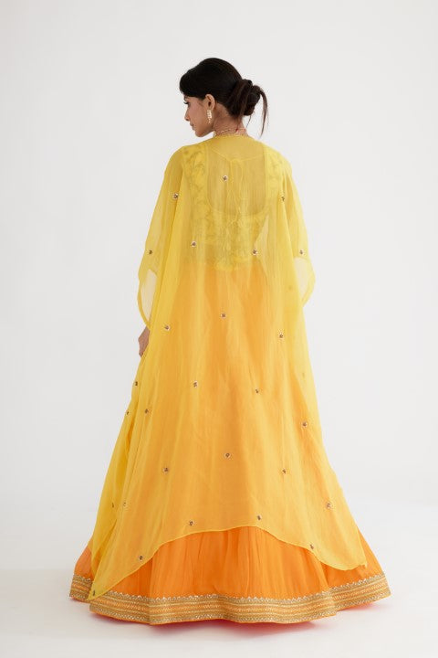 Ochre Yellow Lehenga paired with Yellow Blouse and Cape