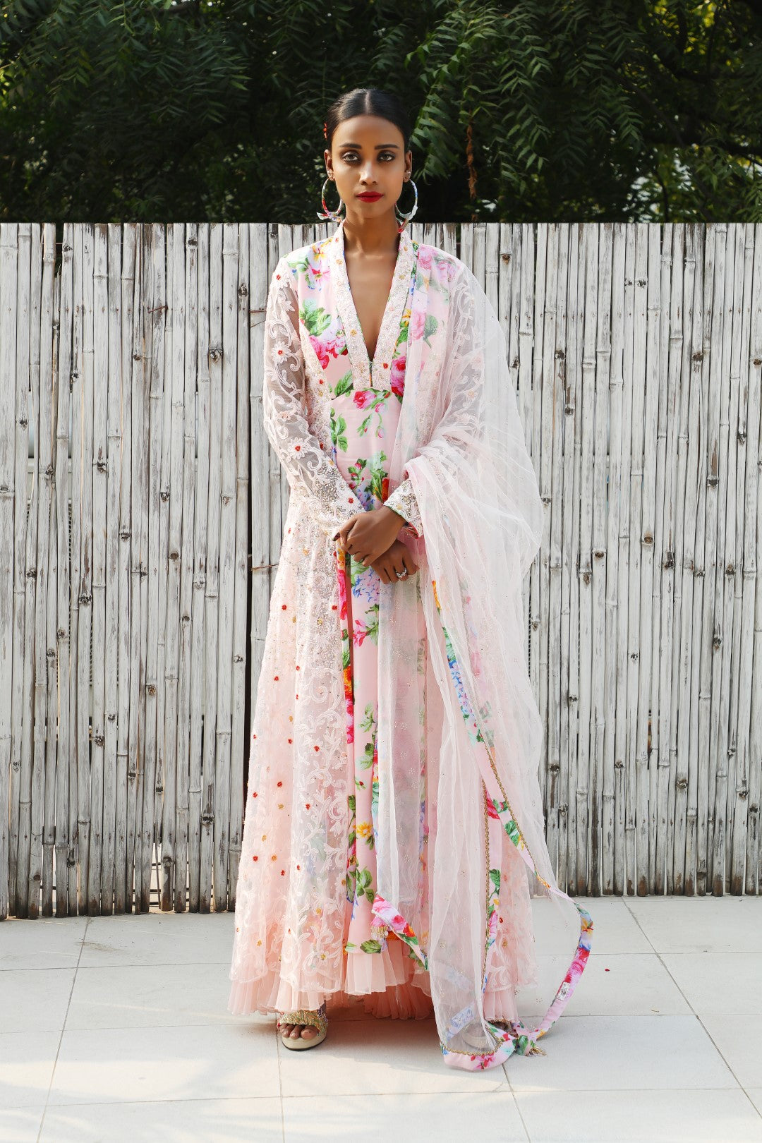 Soft pink vintage rose crepe kalidar teamed with mukaish net dupatta.