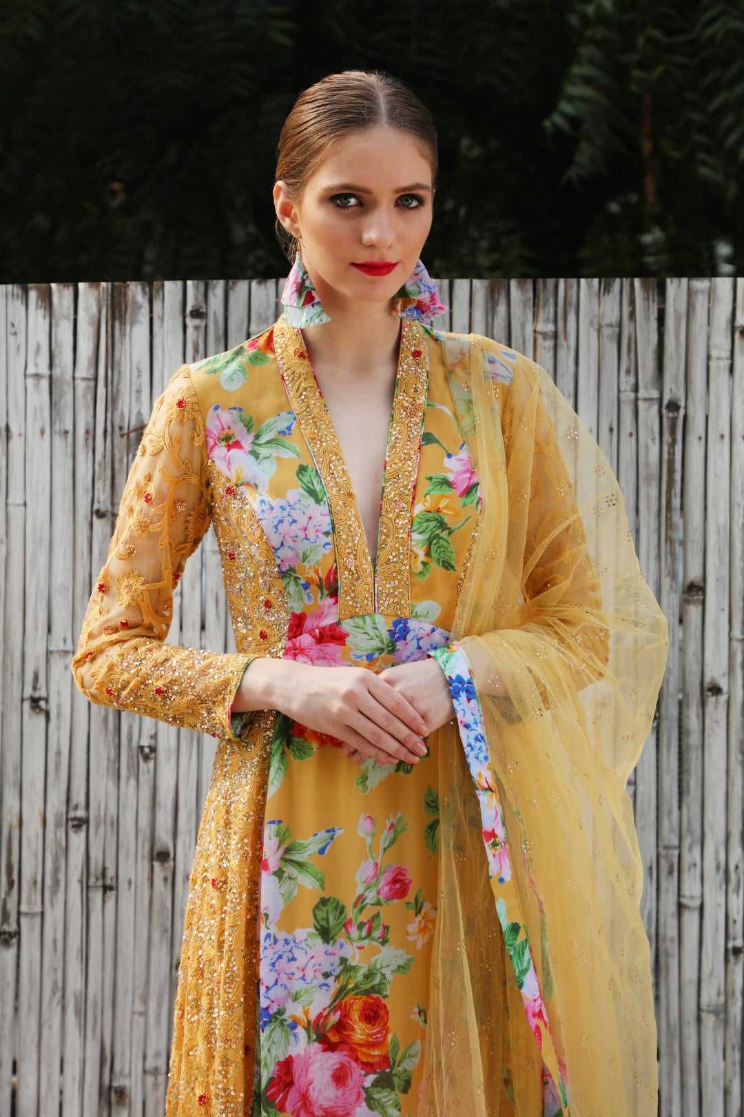 Ochre vintage rose crepe kalidar teamed with mukaish net dupatta.