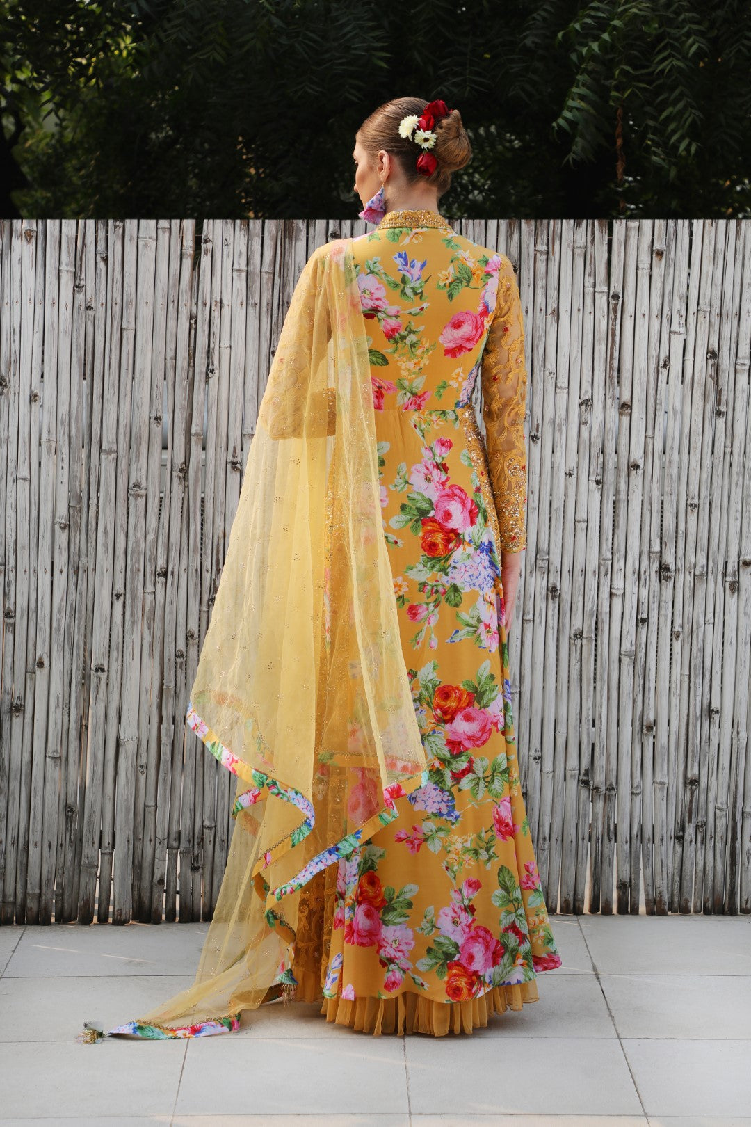 Ochre vintage rose crepe kalidar teamed with mukaish net dupatta.