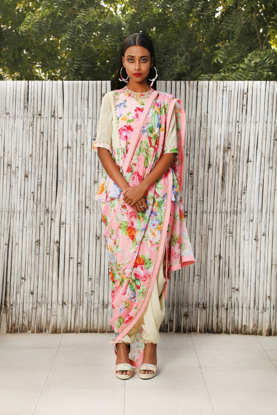 Antique jade georgette dhoti saree teamed with a soft pink VR panel top.