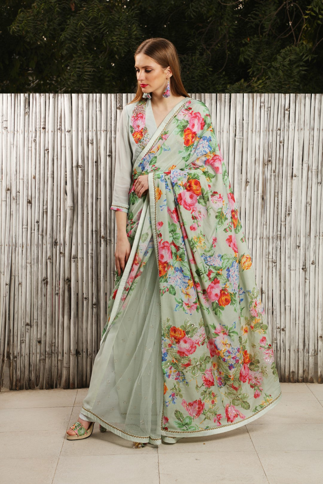 Mint saree with vintage rose as upper wrap with sequin and pita work on palla.