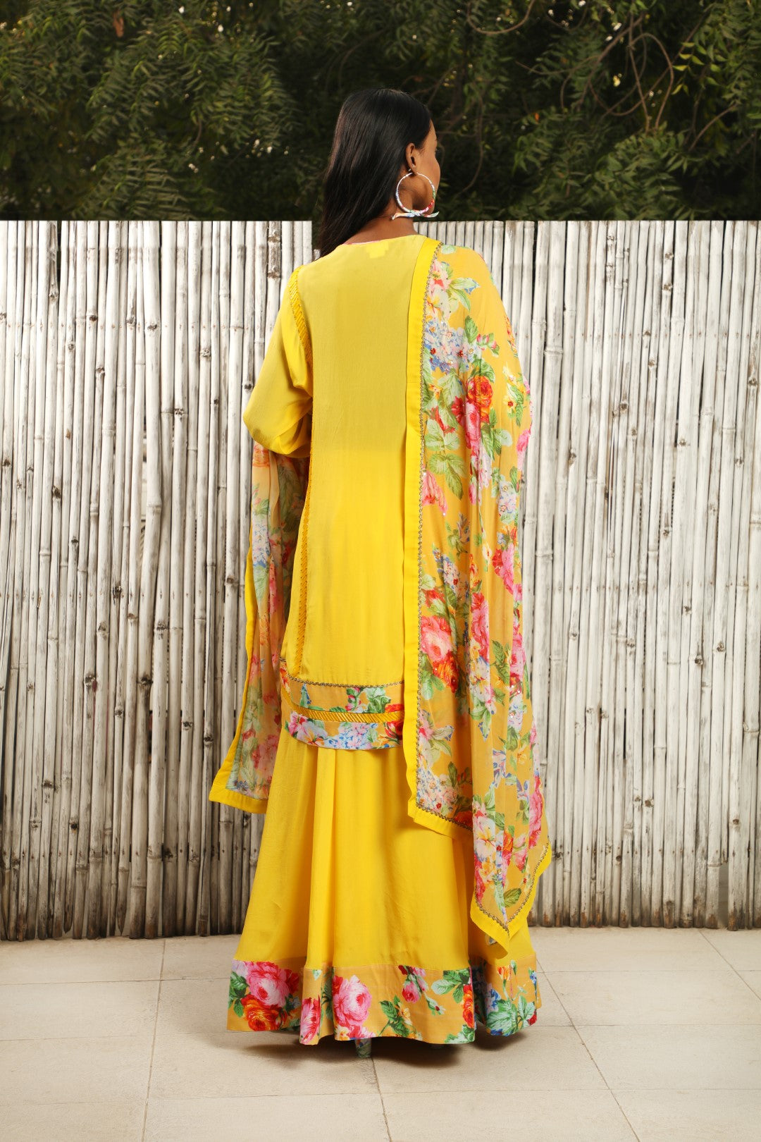 Pitambari yellow crepe kurta with teamed with skirt and highlighted ochre dupatta.