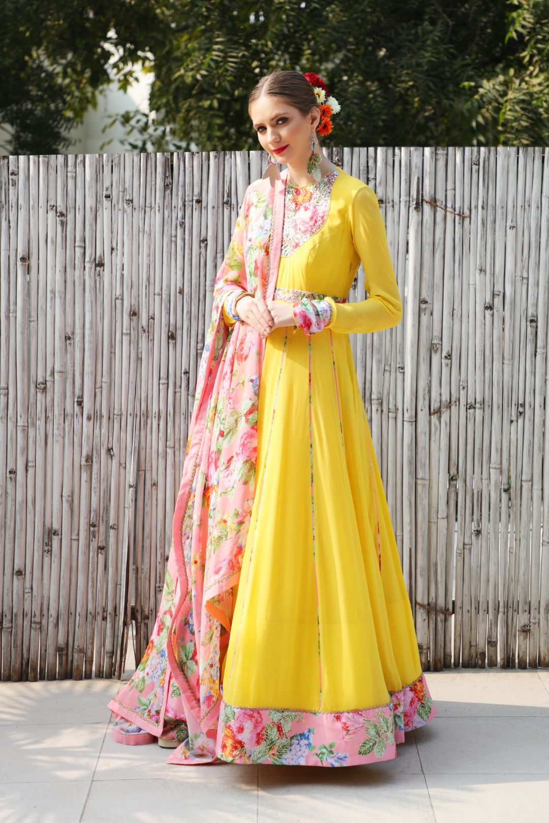 Pitambri yellow georgette kalidar teamed with highlighted mithai pink vintage rose dupatta.