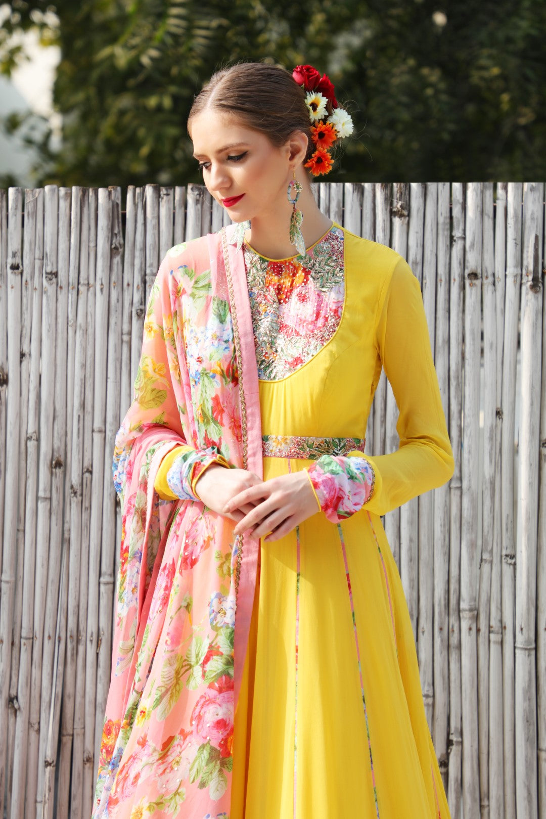 Pitambri yellow georgette kalidar teamed with highlighted mithai pink vintage rose dupatta.