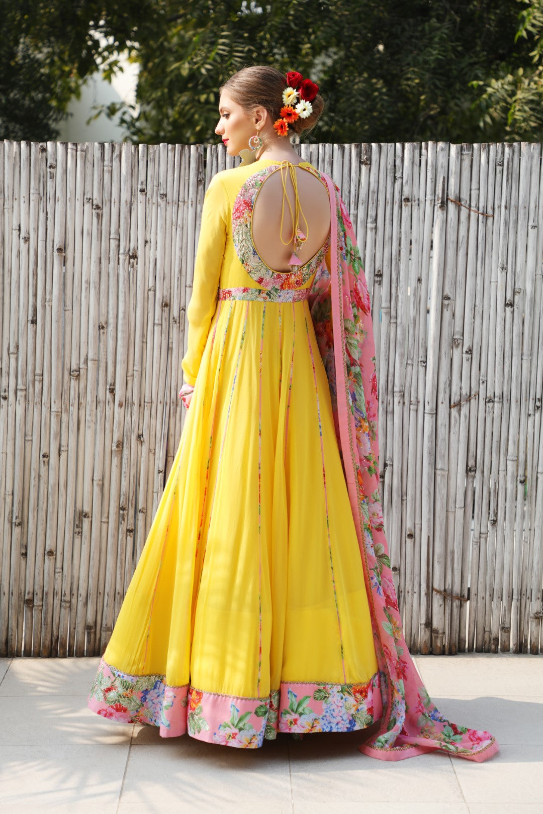 Pitambri yellow georgette kalidar teamed with highlighted mithai pink vintage rose dupatta.