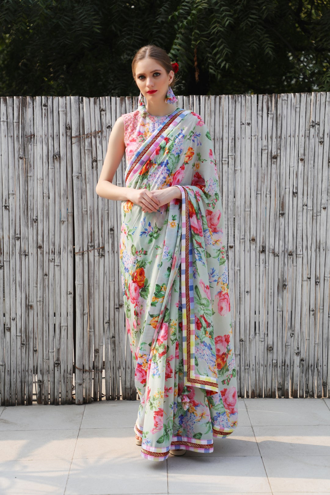 Mint vintage rose crepe saree teamed with mithai pink sleeveless blouse