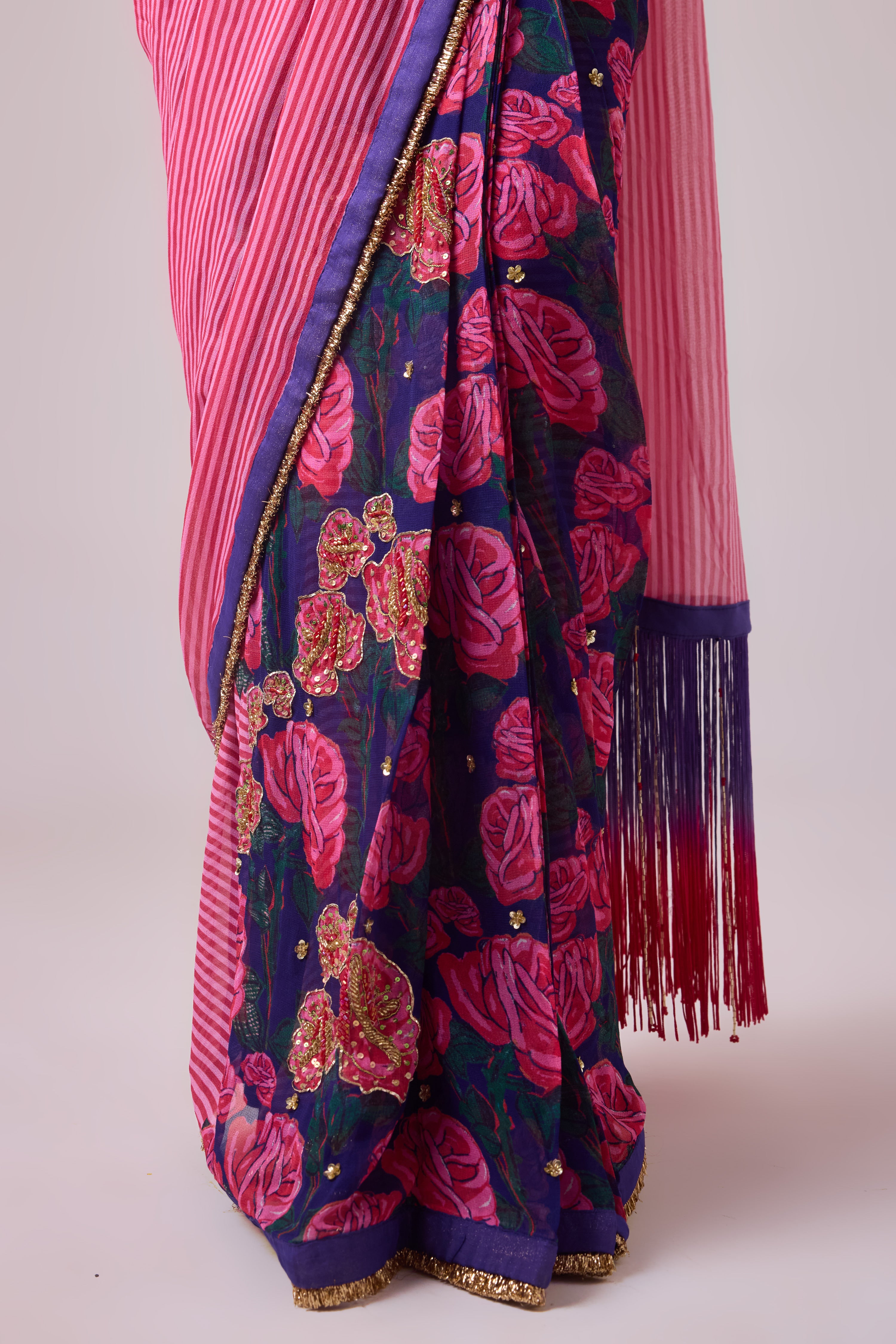 GEORGETTE STRIPED AND ROSE PRINTED SAREE WITH FRINGES DETAIL PAIRED WITH EMB. FLORAL BLOUSE