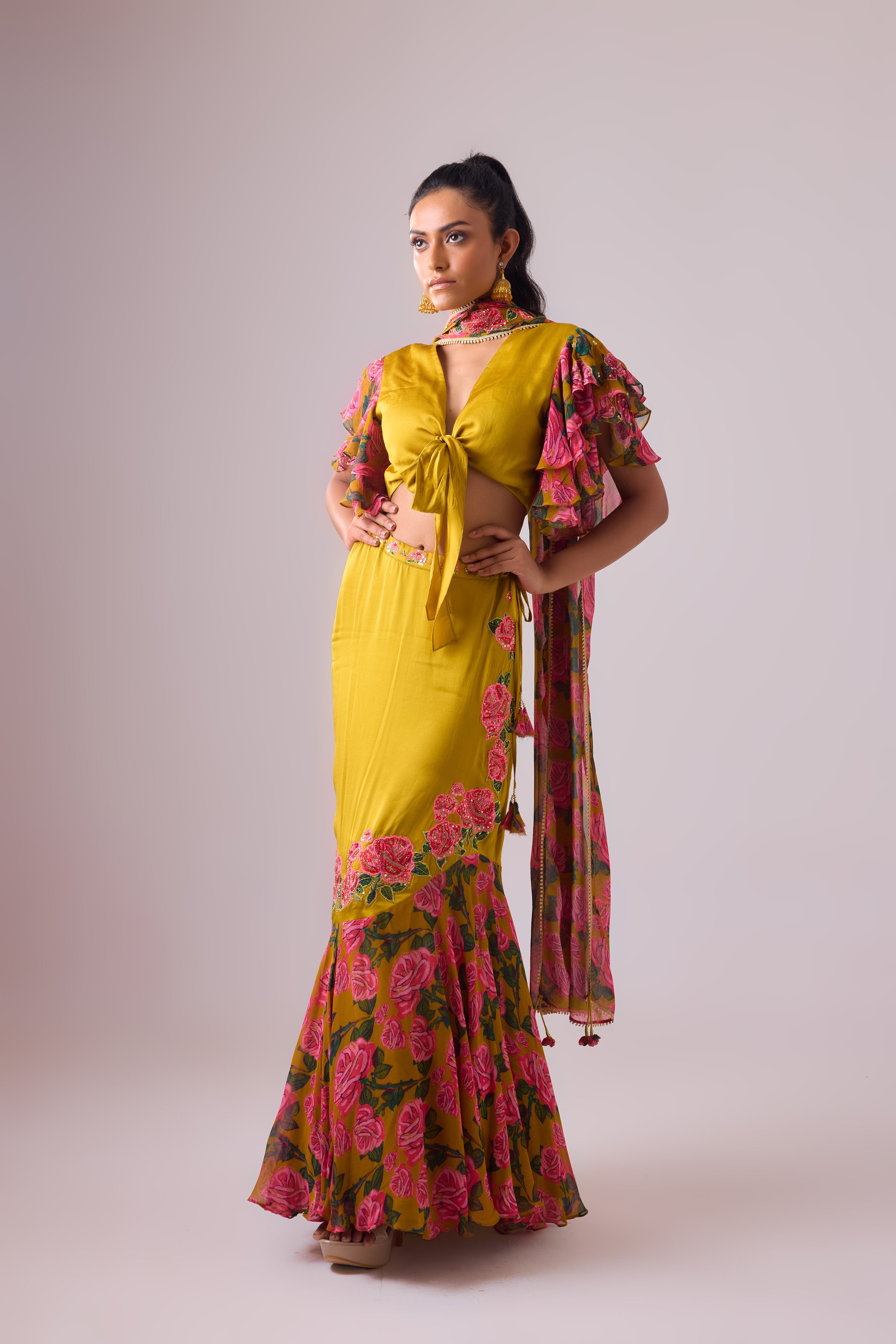 OCHRE LEHENGA  WITH TWIST  OF FRILLS     AND BLOUSE WITH FLARED SLEEVES