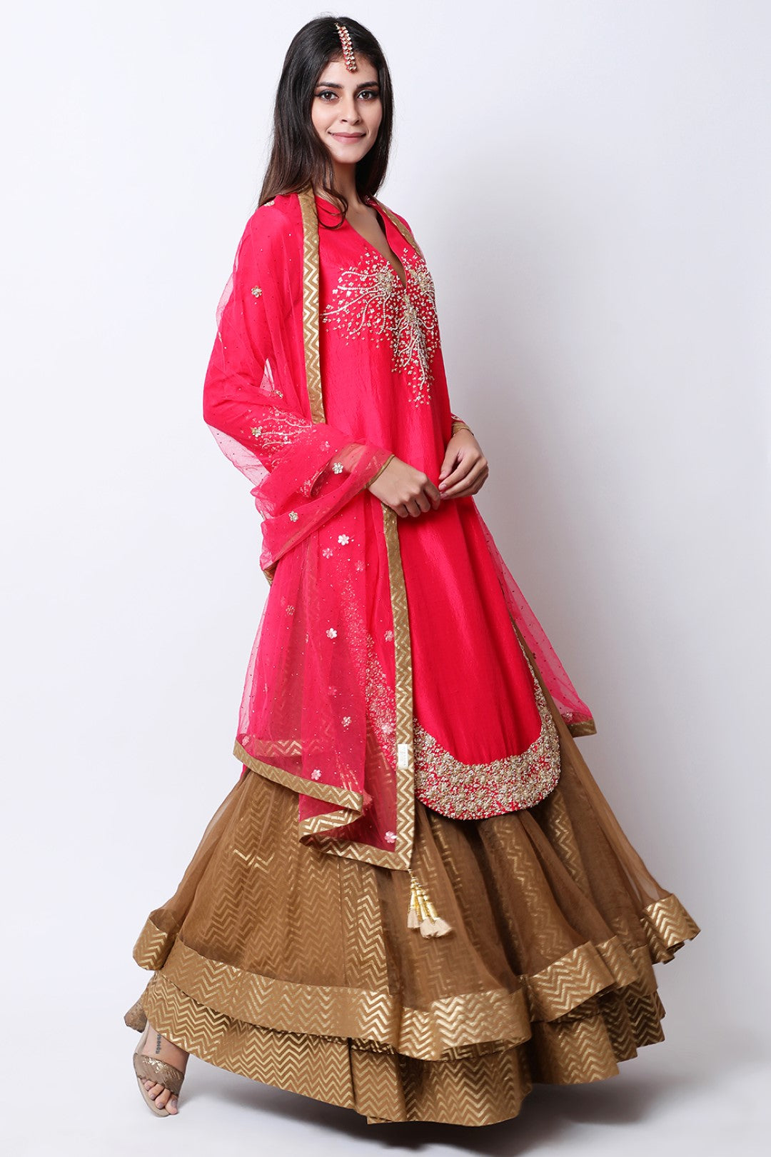 Rose Red apple cut kurta  , paired dupatta and tabacco double layered skirt.