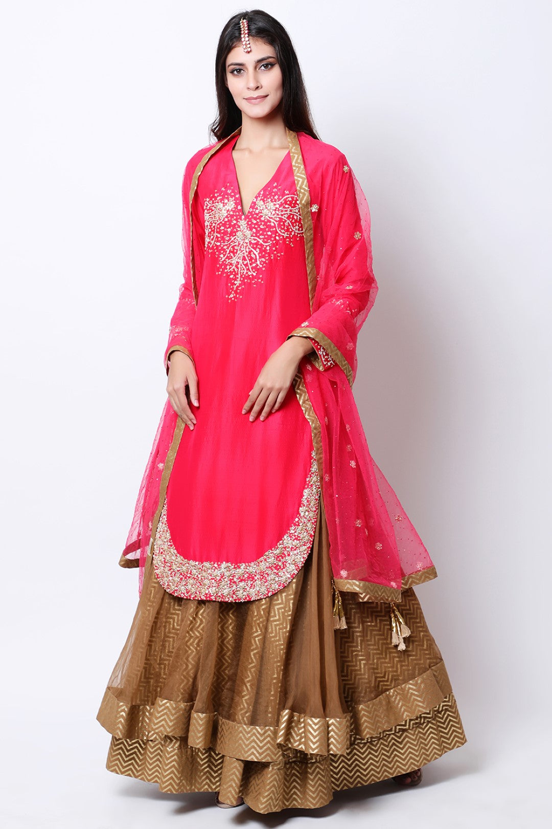 Rose Red apple cut kurta  , paired dupatta and tabacco double layered skirt.
