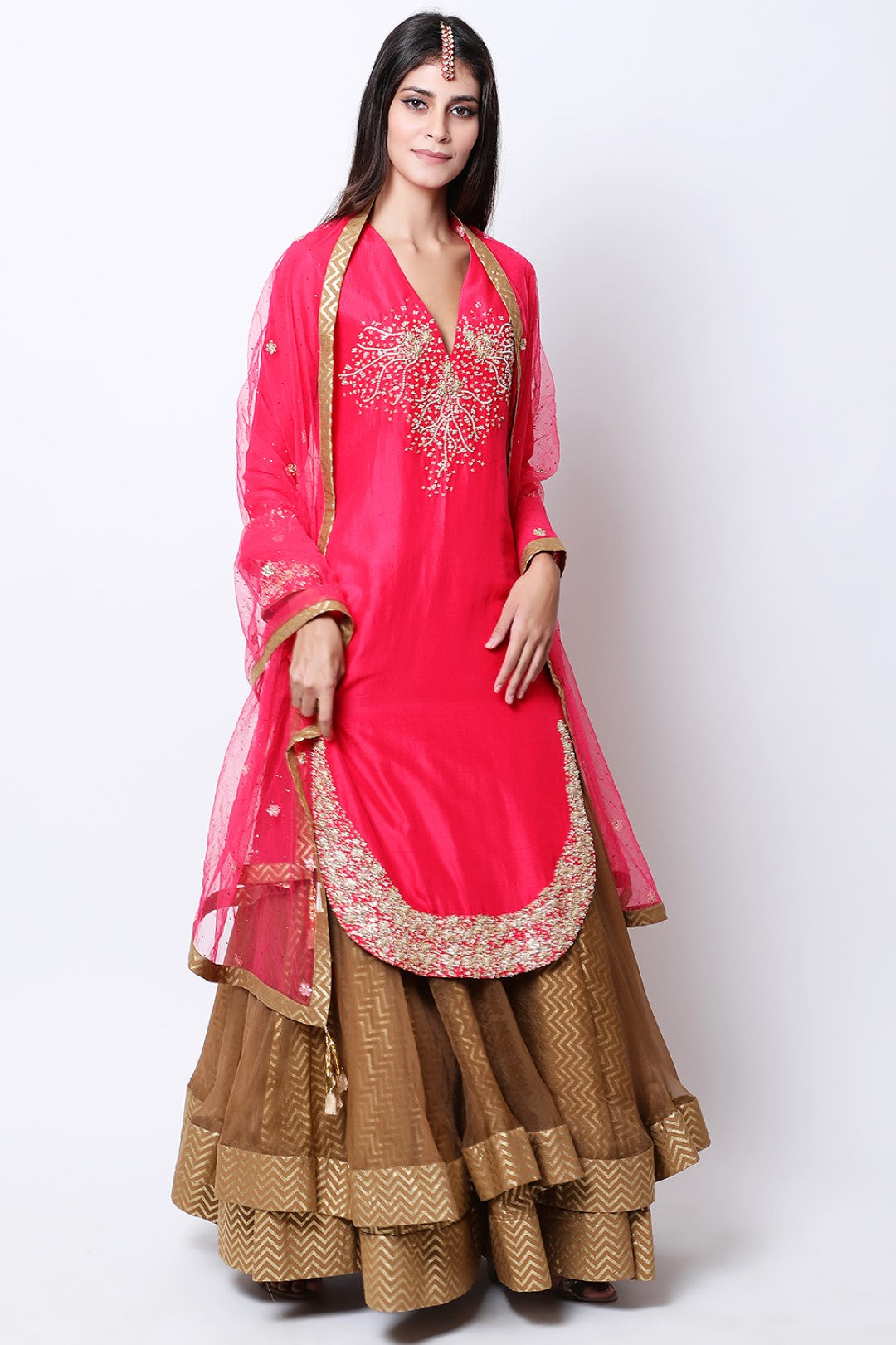 Rose Red apple cut kurta  , paired dupatta and tabacco double layered skirt.