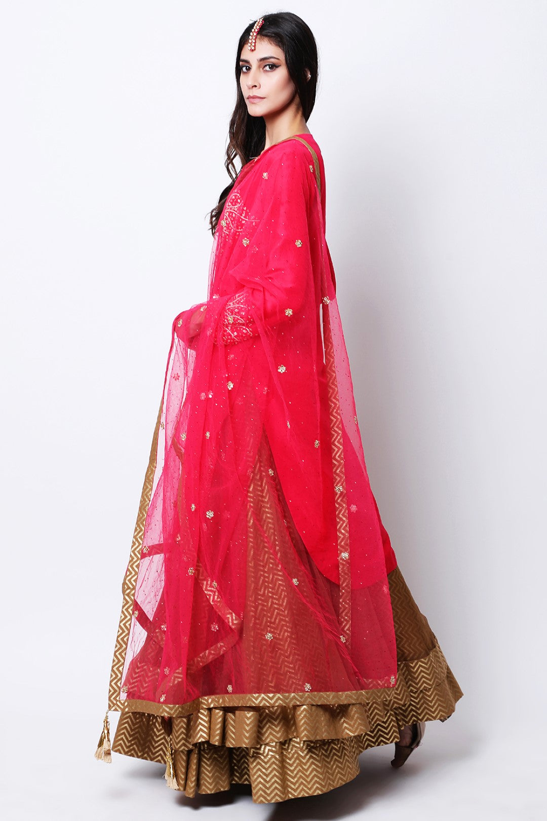 Rose Red apple cut kurta  , paired dupatta and tabacco double layered skirt.