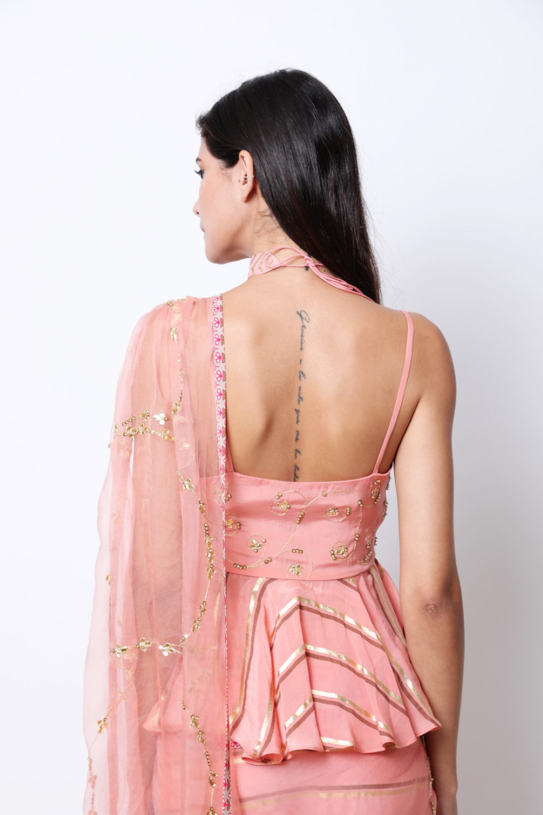 Vintage rose leheriya pre-pleated crepe saree with embroidered drape and peplum embroidered blouse.