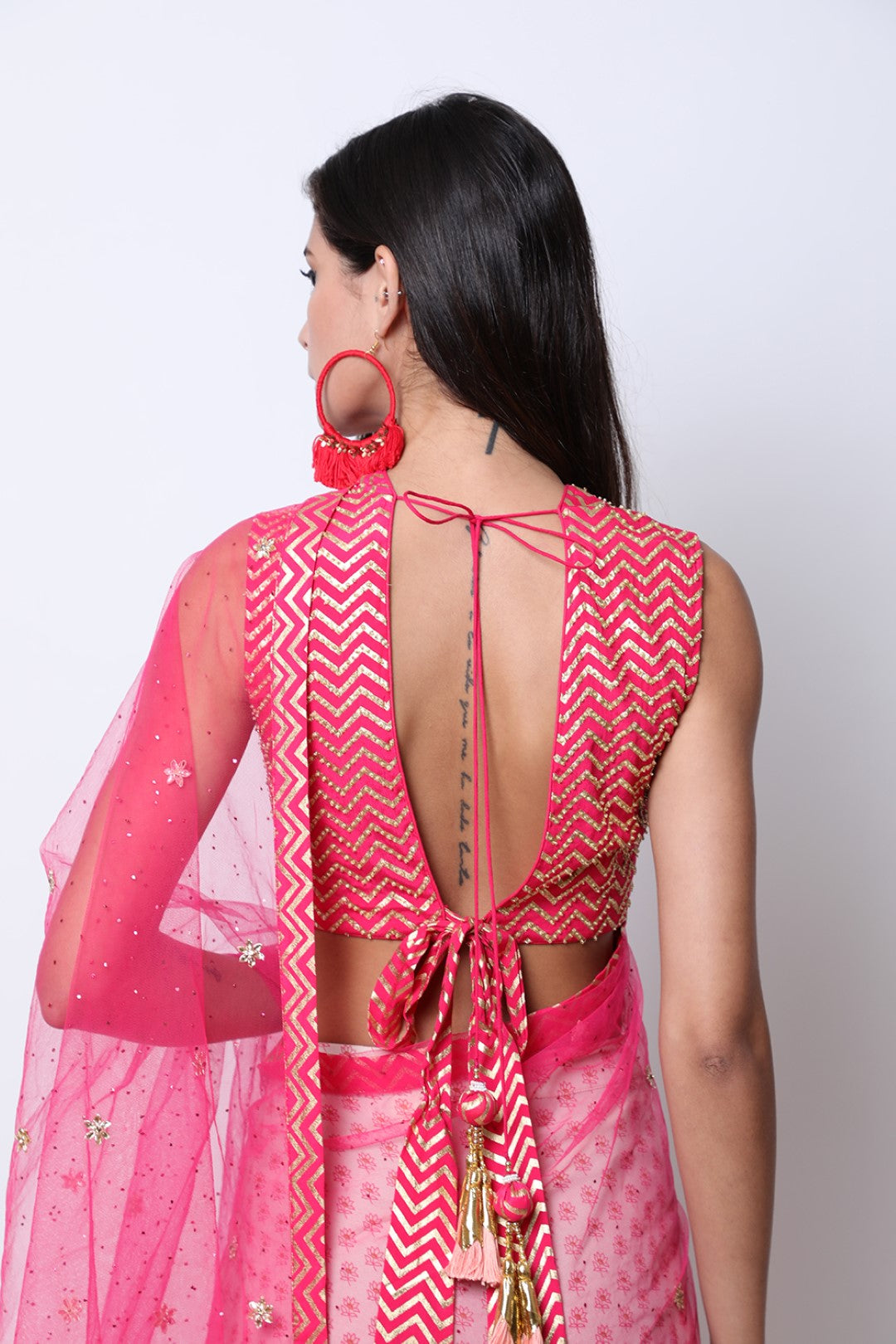 Rani Pink blouse with ghee print double layer godets skirt with attached embroidered palla.