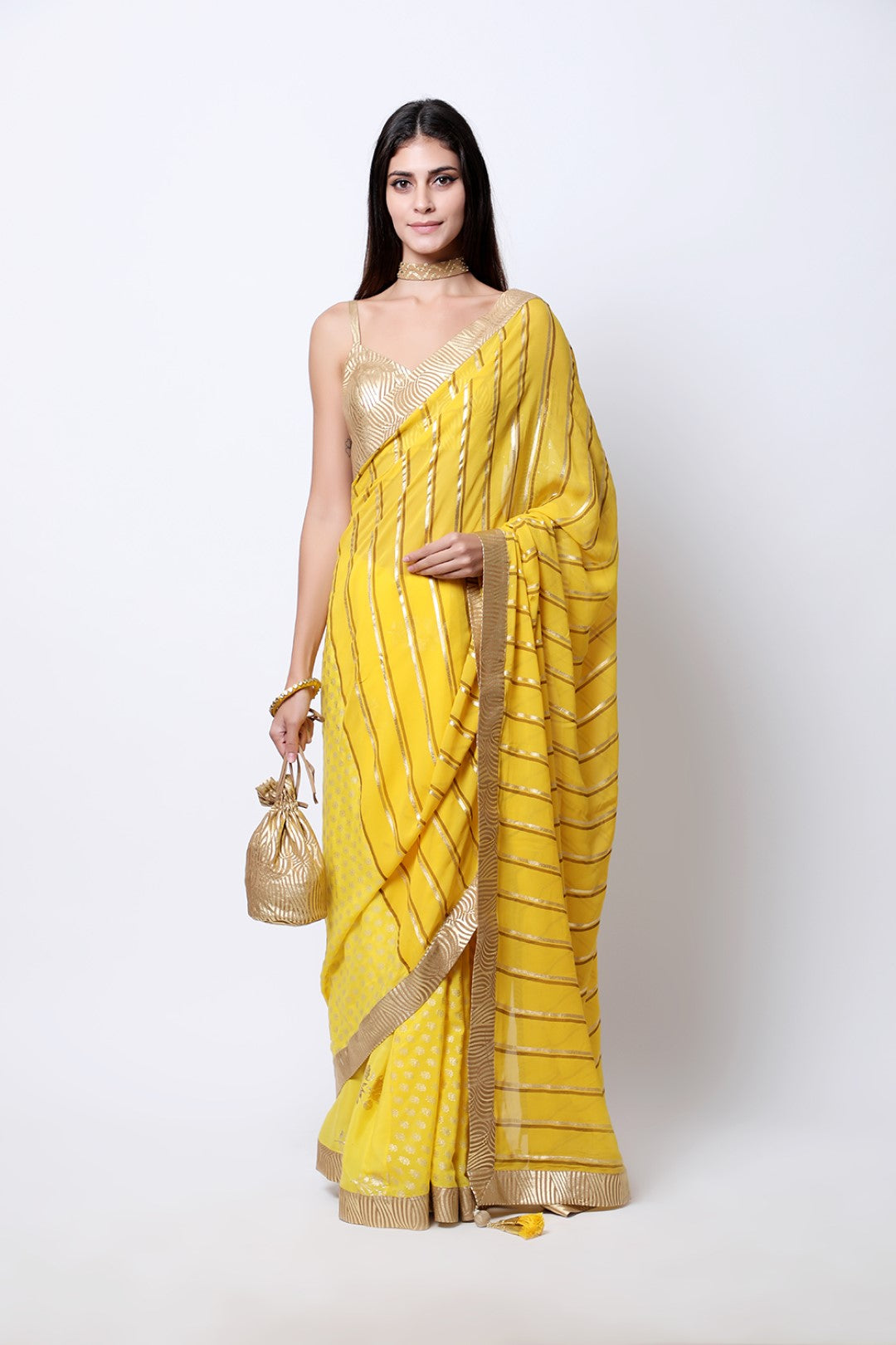 Pitambari Yellow leheriya crepe palla with jaipuri guldasta pleated saree , paired with tabacco swirl strap blouse.