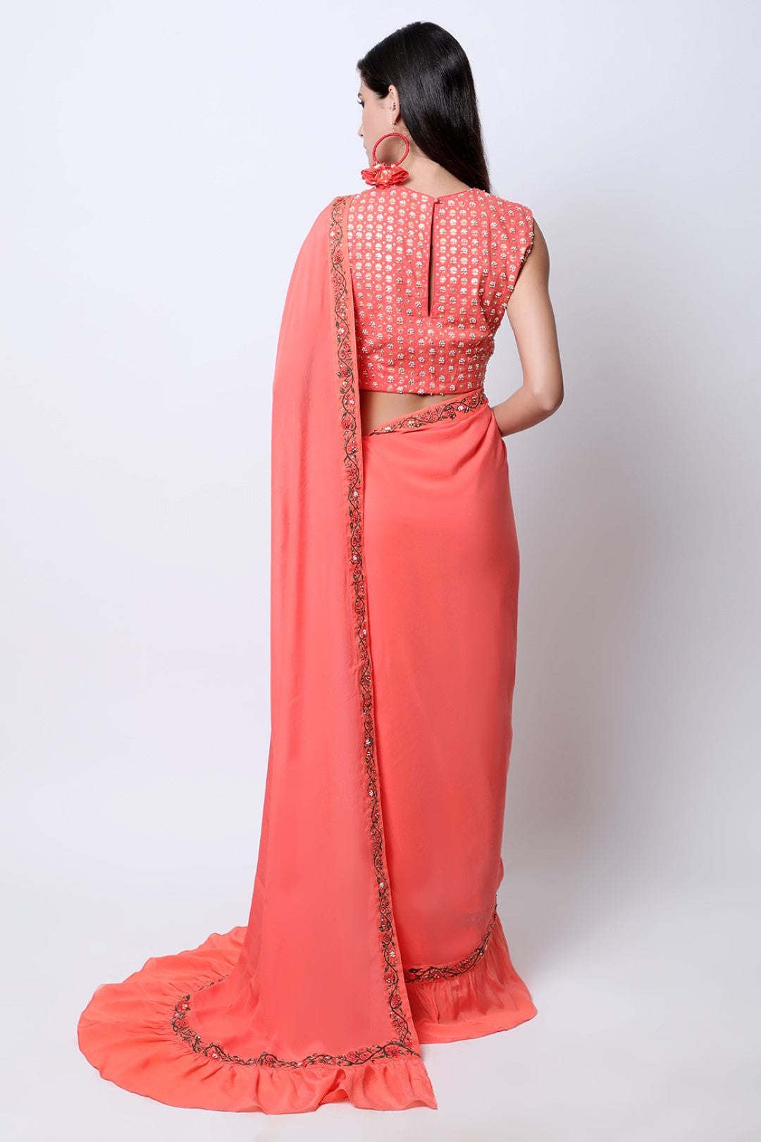 Gajari Coral frill saree with bel detail , paired with chotu sanga gold printed hand-embroidered blouse.