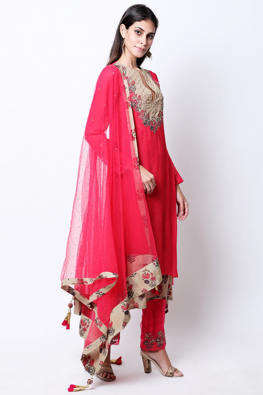 Rose red double layered  asymmetric tunic , paired with mukesh dupatta and pants.