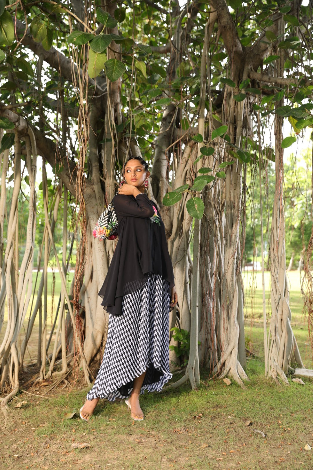Black georgette tunic paired with pleated lehraiya skirt