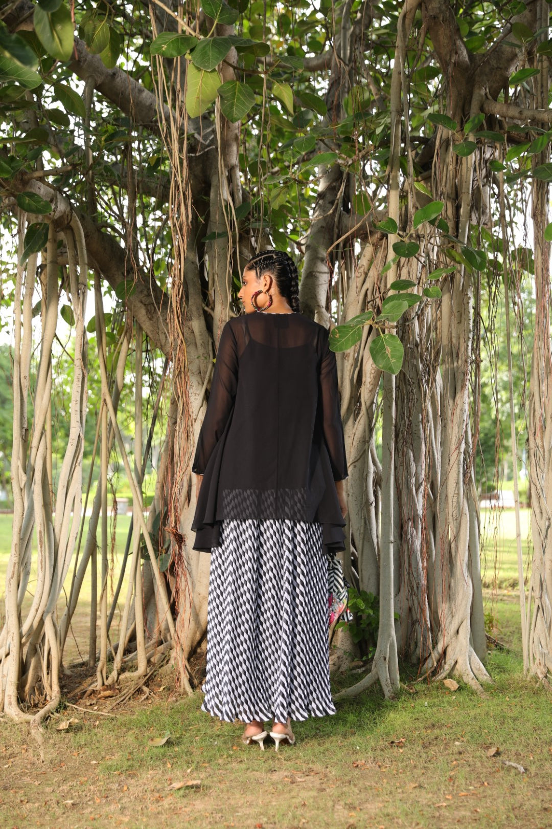 Black georgette tunic paired with pleated lehraiya skirt