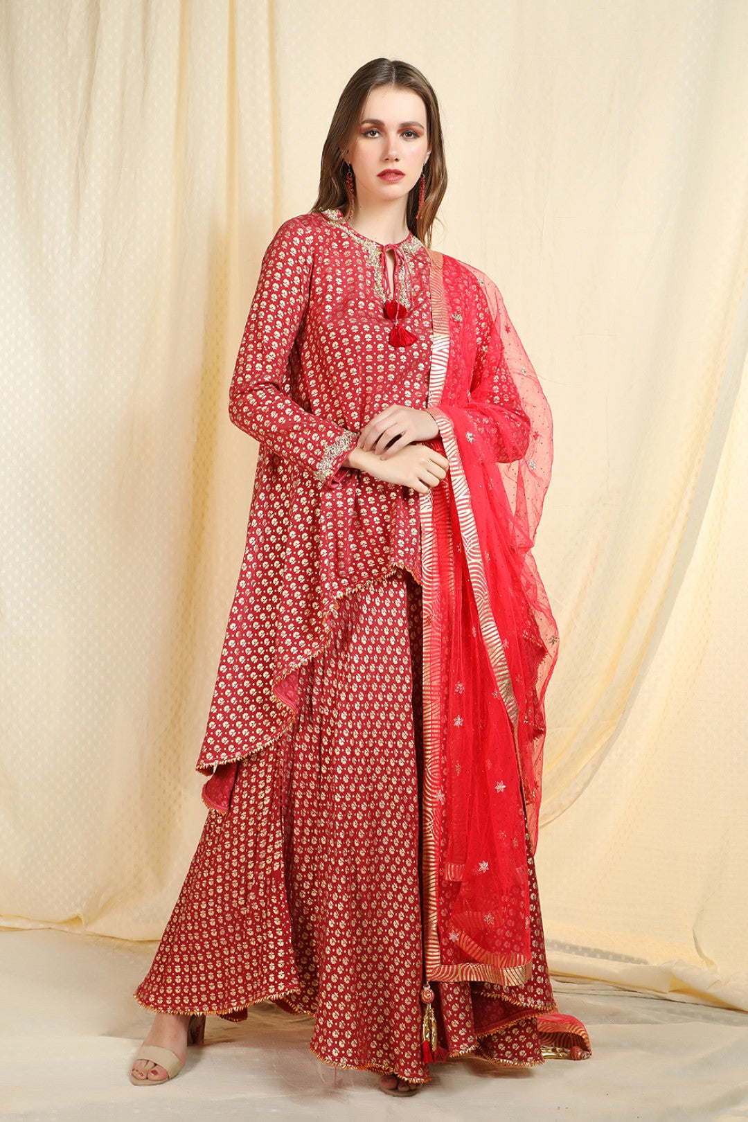 burgundy asymetric kurta with skirt and net duapatta
