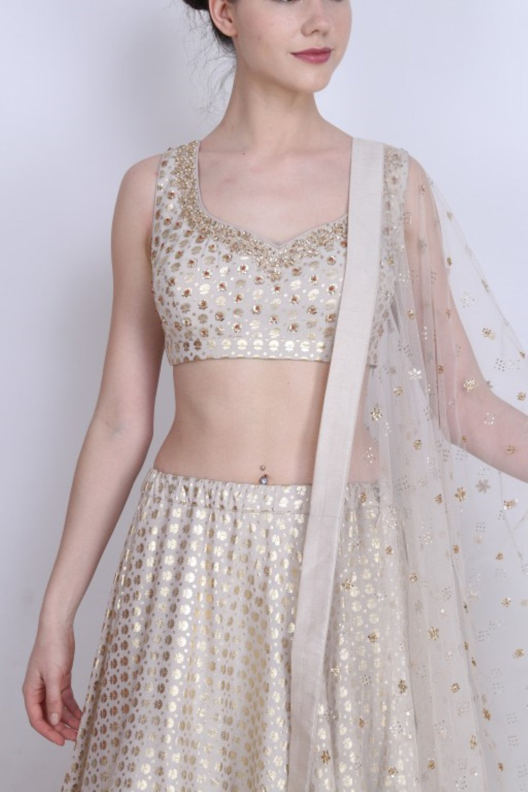 Ghee gold foil printed lehenga with embroidered blouse and embroidered mukesh net dupatta.