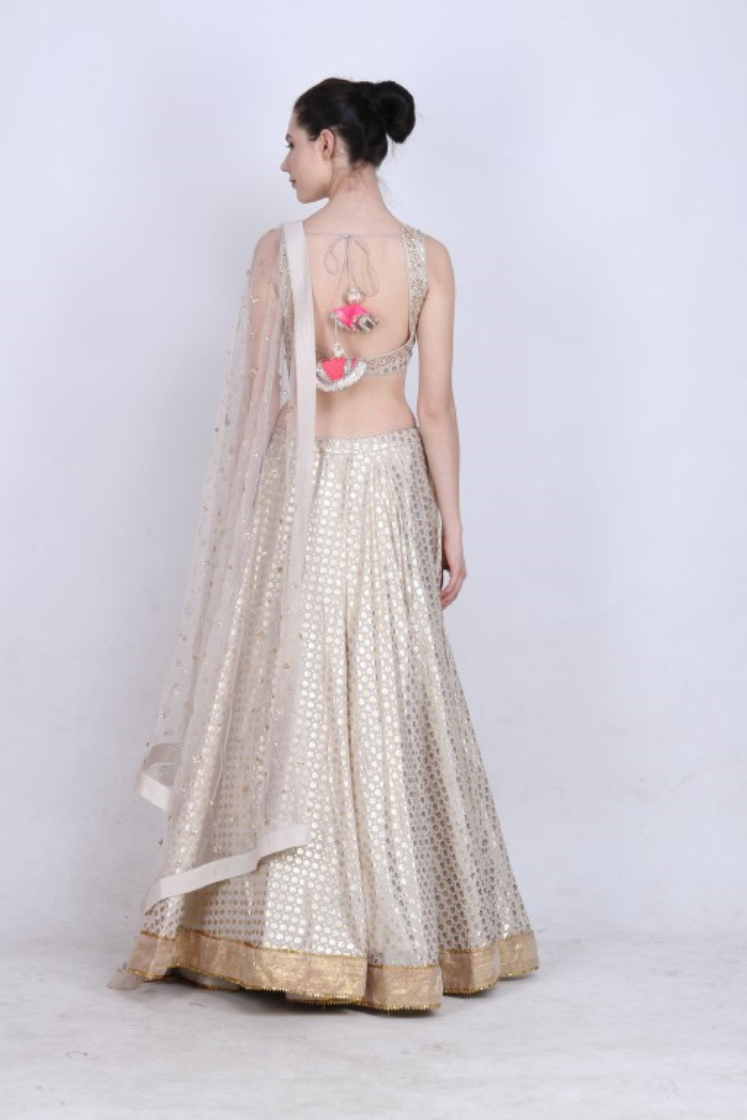 Ghee gold foil printed lehenga with embroidered blouse and embroidered mukesh net dupatta.