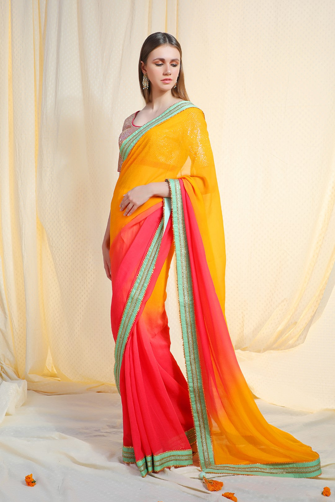 Ombre haldi to coral gajari chiffon saree with pista abla border