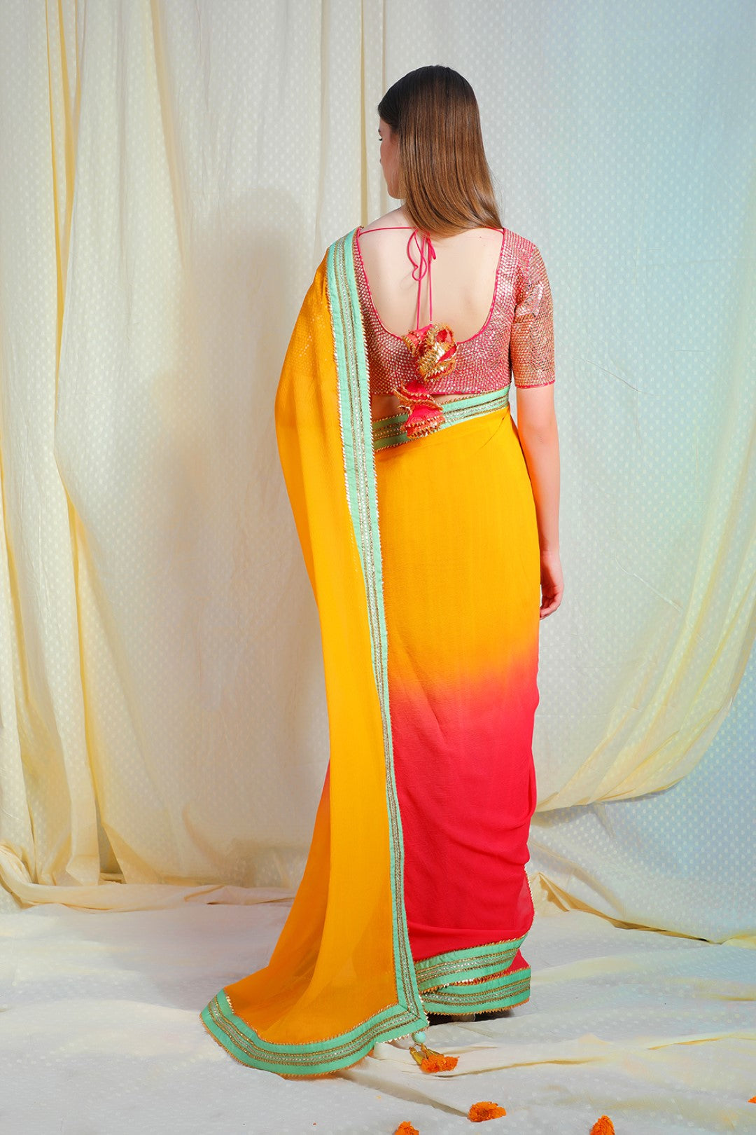 Ombre haldi to coral gajari chiffon saree with pista abla border