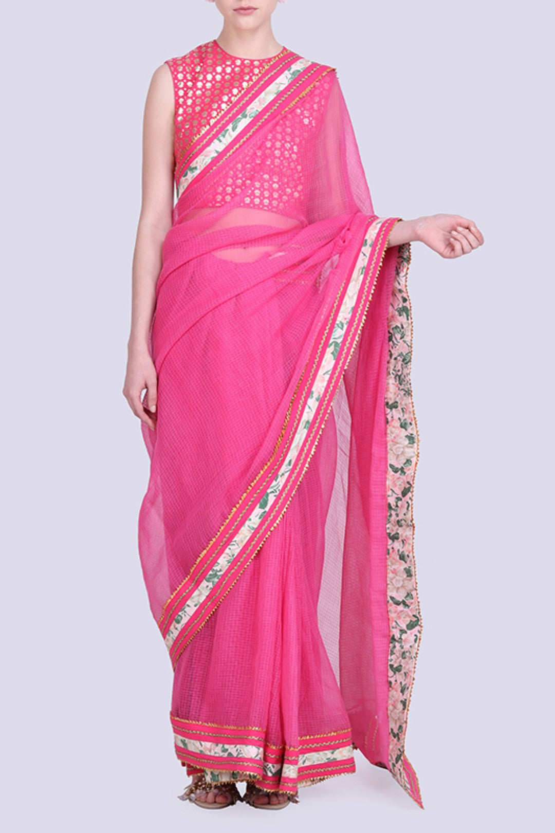 Hot pink pink kota doria saree gota border with a gold foil printed blouse .
