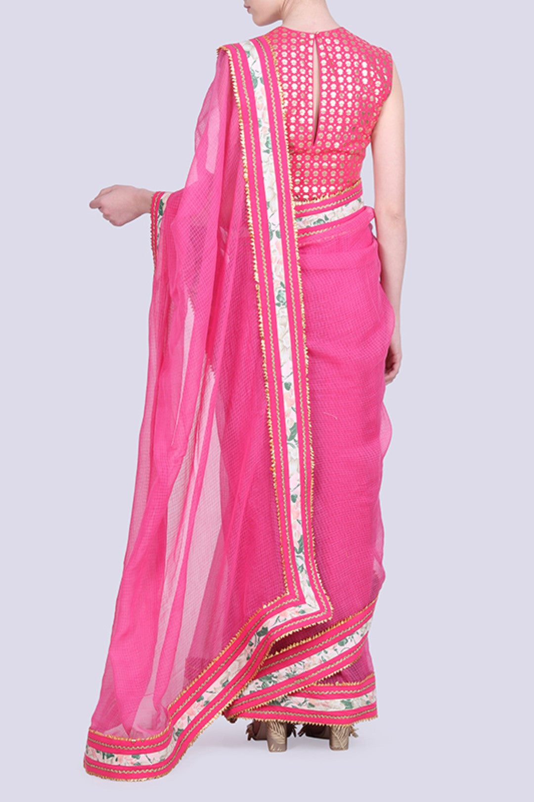 Hot pink pink kota doria saree gota border with a gold foil printed blouse .