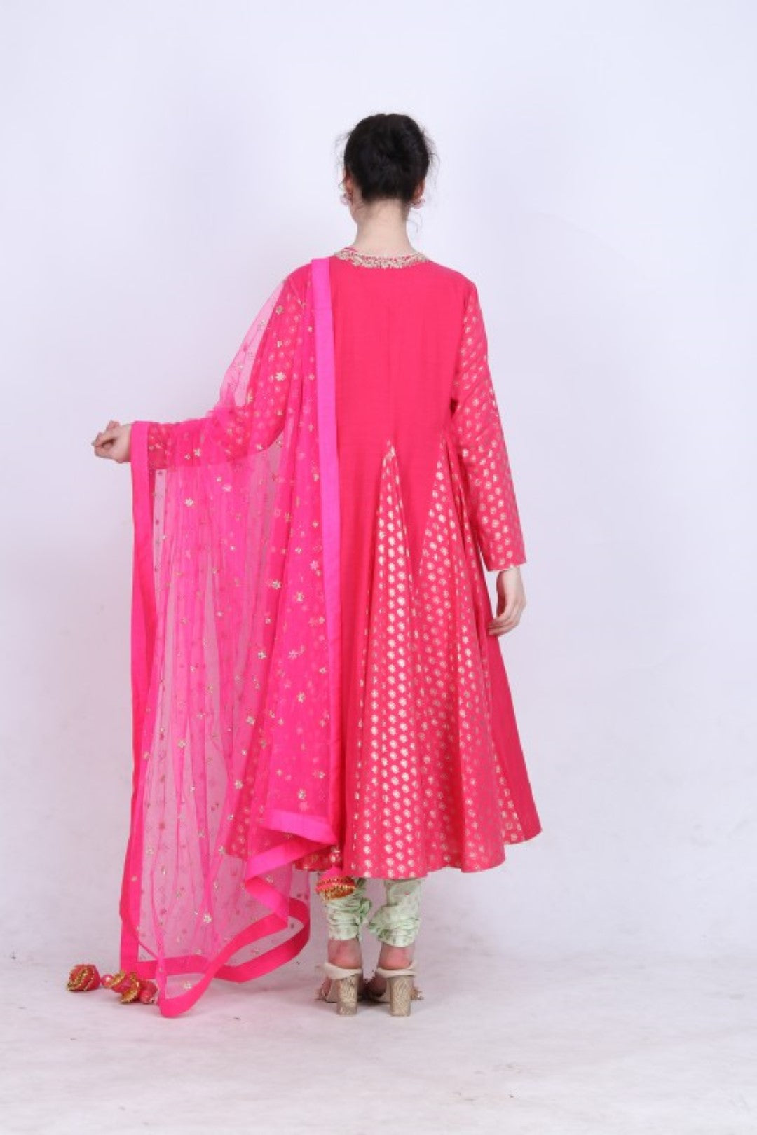 Hot pink gold foil printed goddet styled kurta with embroidered mukesh net dupatta and gold foil printed pista churidar.