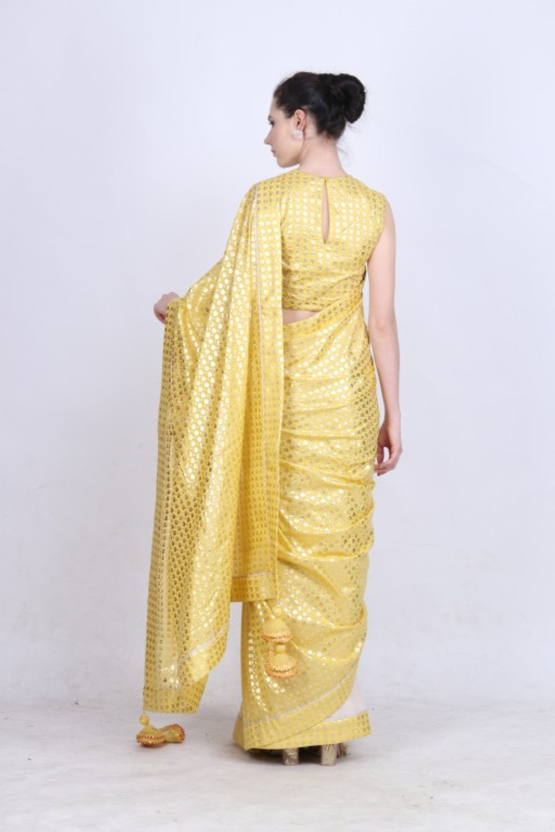 Pitambari yellow gold foil printed crepe  and crushed cotton half & half saree with blouse.