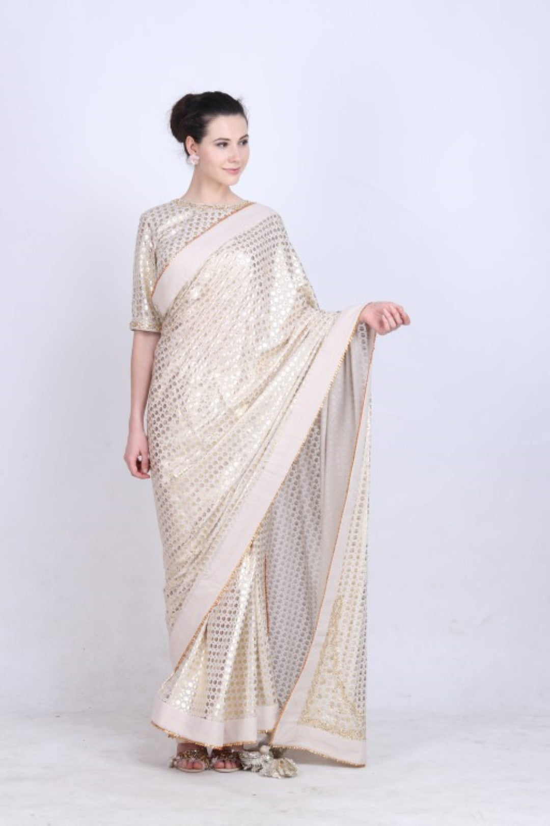 Crepe ghee  gold foil printed saree with embroidered palla paired with blouse.