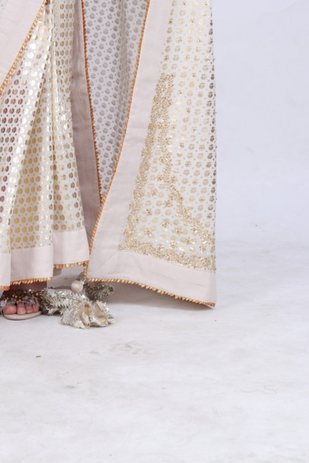 Crepe ghee  gold foil printed saree with embroidered palla paired with blouse.