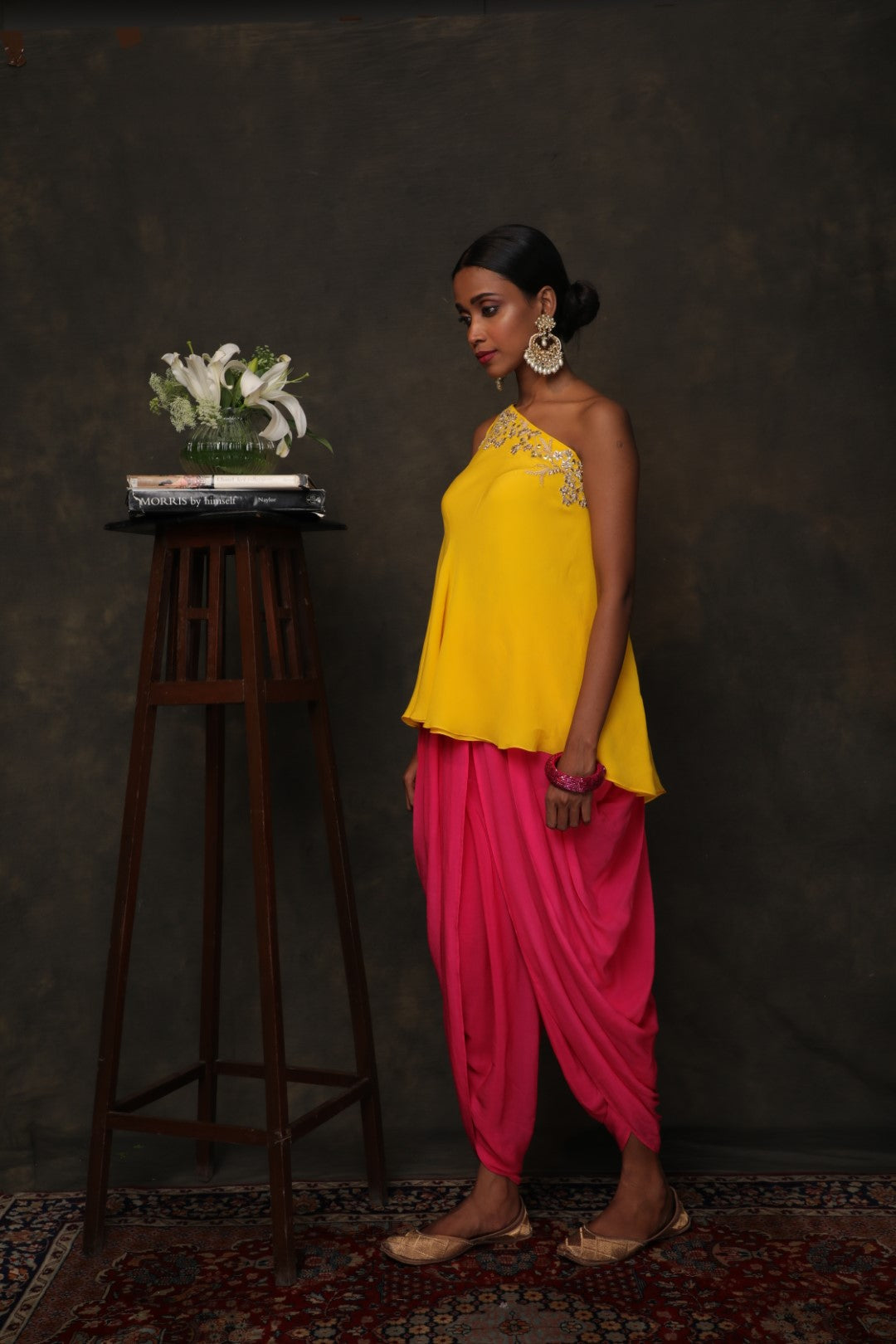 Yellow crepe one shouldered top with rani pink dhoti pants