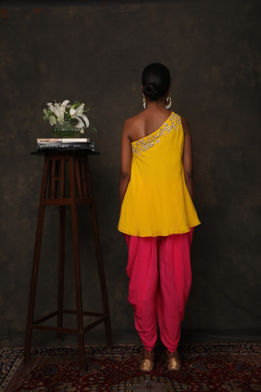 Yellow crepe one shouldered top with rani pink dhoti pants
