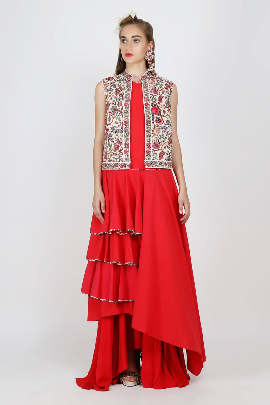 sleeveless jacket paired with red tier tunic with ryon moss skirt.