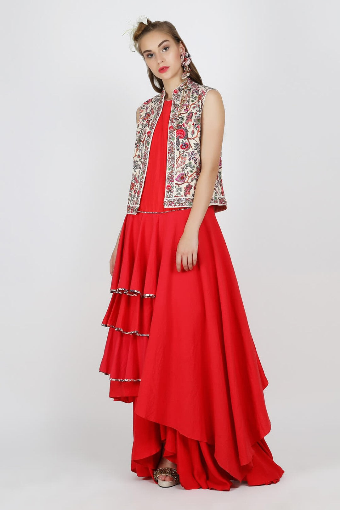 sleeveless jacket paired with red tier tunic with ryon moss skirt.