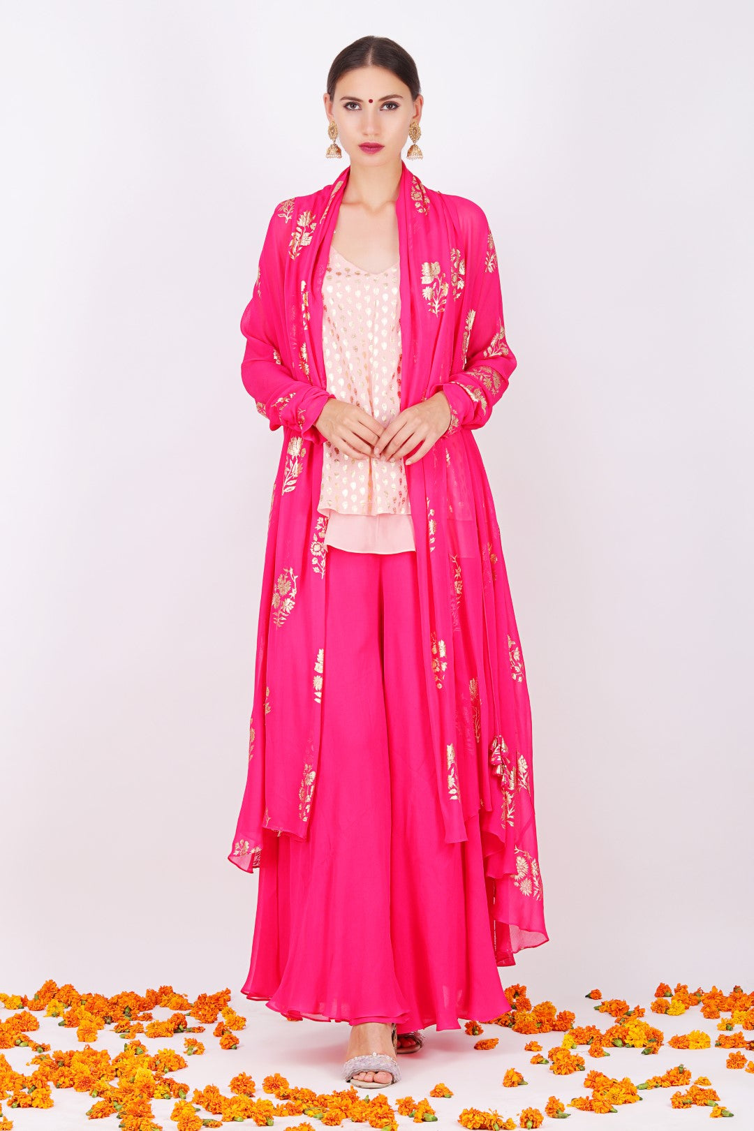 Rani pink georgette foil printed shrug with dusky salmon crepe cami top and sharara.