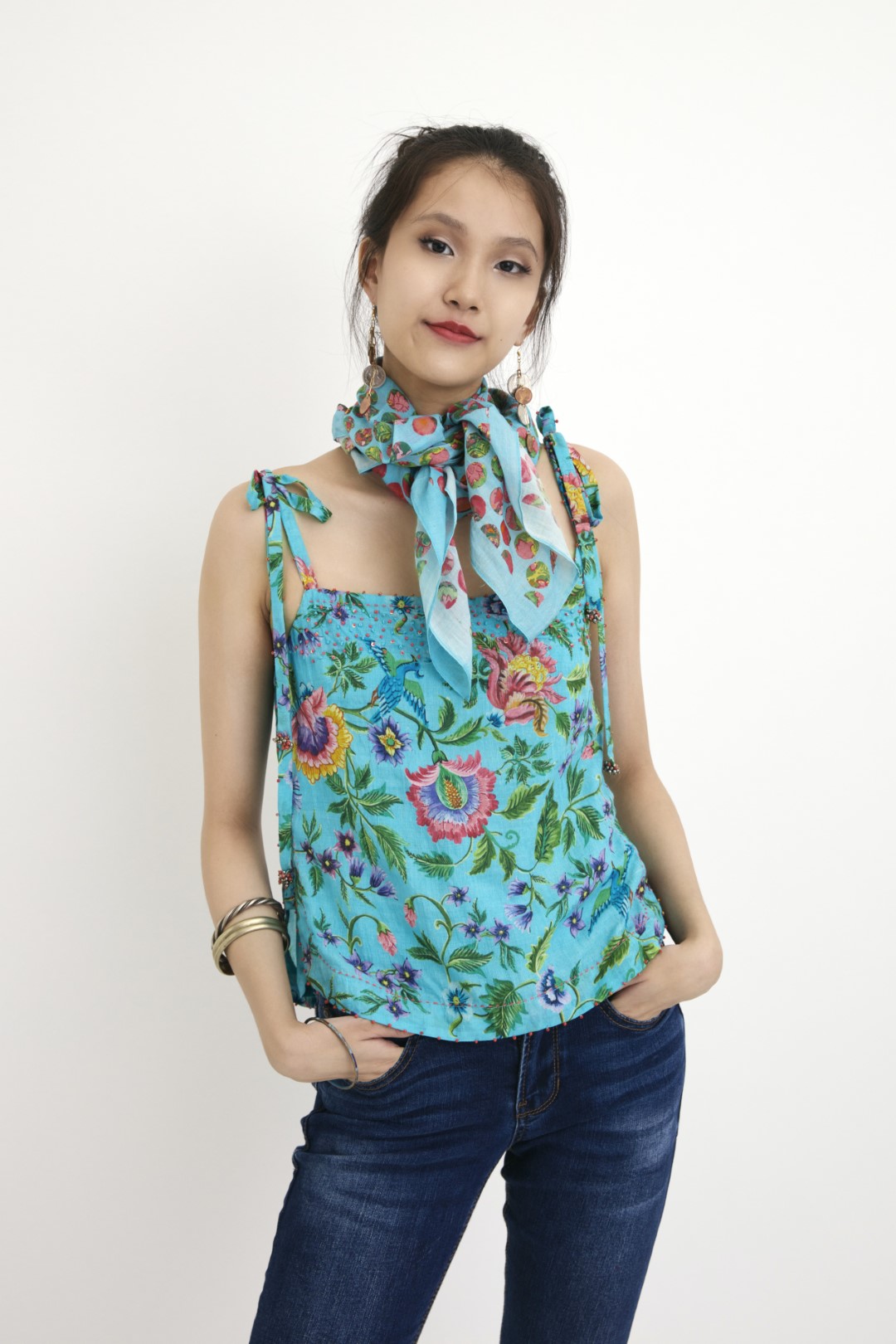 "Handwoven blue hand-painted chintz printed camisole in handwoven silk cotton, embellished with french knots and sequins. 100% Handwoven cotton silk; Lining:100% cotton 100% Azo Free Dry Clean Only"