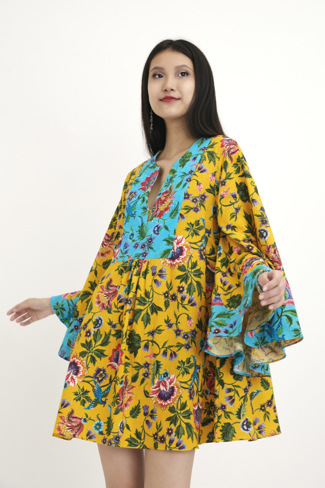 "Handwoven yellow chintz Hand-painted print and blue chintz detailed tunic with hand embroidery in french knots and sequins detail. 100% Handwoven cotton; Lining: 100% cotton 100% Azo Free Dry Clean Only"